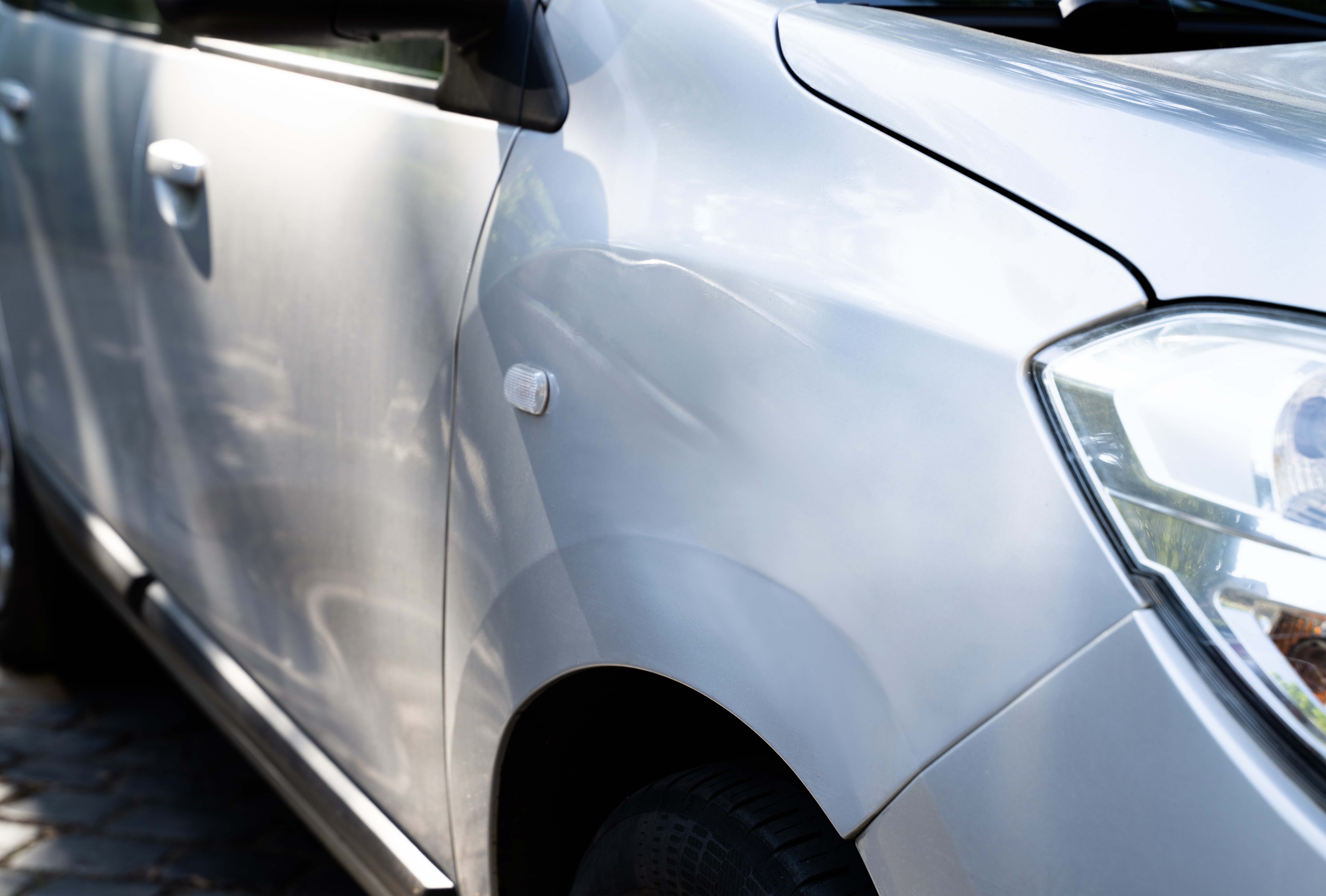 Hail damaged car before repair