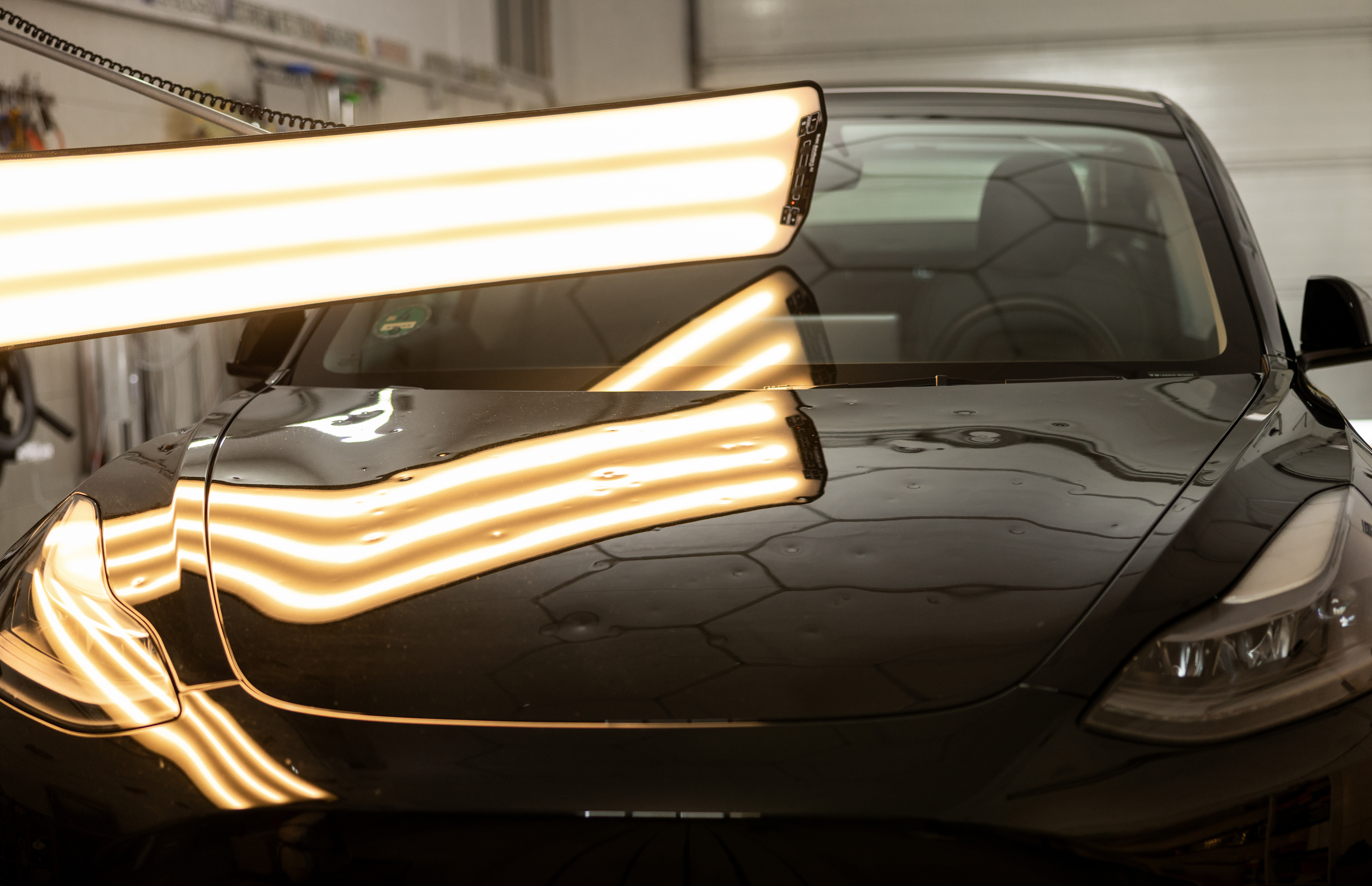 Hail-damaged car repaired to factory finish